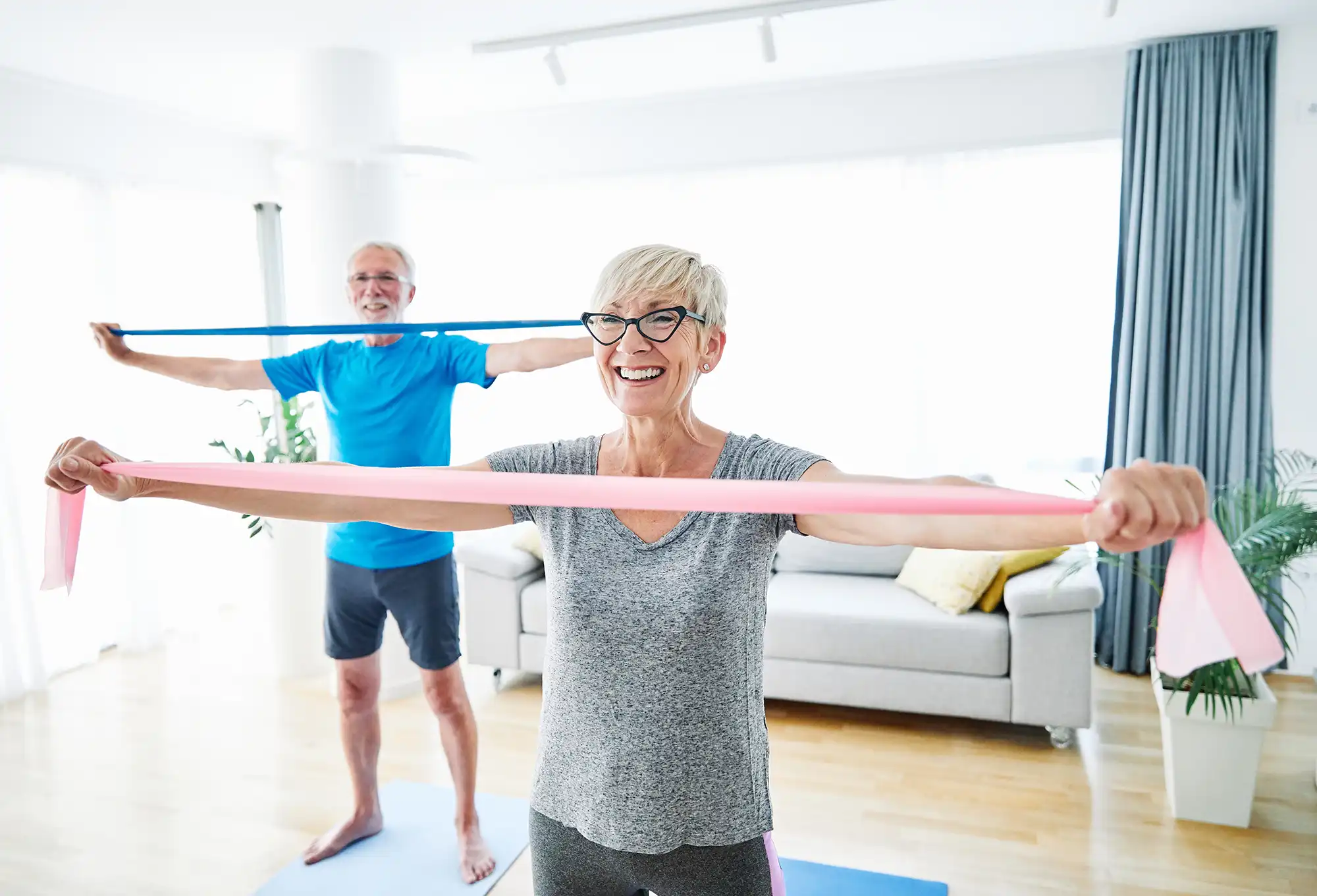 senior-couple-exercising-at-home